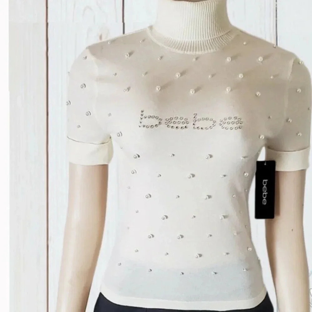 . NWT BEBE AUTHENTIC WOMENS MARSHMALLOW PEARLS TURTLE NECK SHORT SLEEVE …